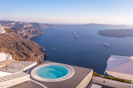 Sunset shot of a pool on a terrace in Oia, Santorini, Greeceのeditorial素材