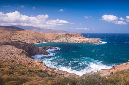 Seascapes showing clear blue water hitting the coast of Andros island in Greece. Shot during a beautiful, sunny day. Perfect for tourist attractionの写真素材