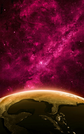 Earth at night as seen from space with blue, glowing atmosphere and space at the top. Perfect for illustrations.の写真素材