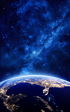 Earth at night as seen from space with blue, glowing atmosphere and space at the top. Perfect for illustrations. Elements of this image furnished by NASA. 3d illustrationの写真素材