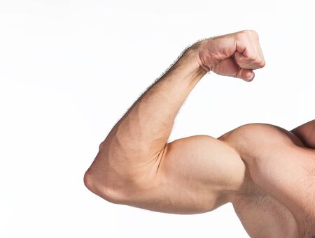 Close up photo of a strong man with big biceps flexing his arm on white background. View from the front. Copy space for text.の写真素材