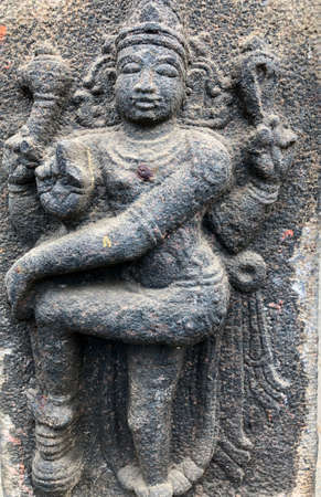 Bas relief sculpture of Hindu God carved in the walls of Shiva temple at Tamil naduの写真素材