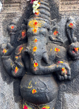 Bas relief sculpture of Hindu God carved in the walls of Shiva temple at Tamil naduの写真素材