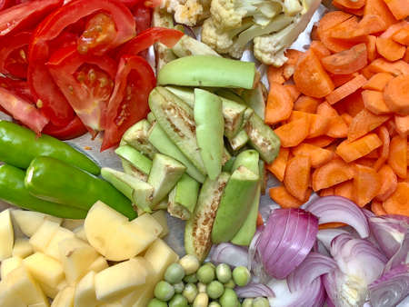Raw colorful vegetables in a plateの写真素材