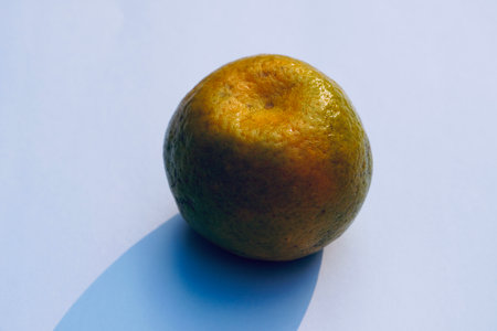 Sweet orange fruit kept in the market stall for sale. Orange fruit isolated in white background. Sweet orange and its shadow.の写真素材