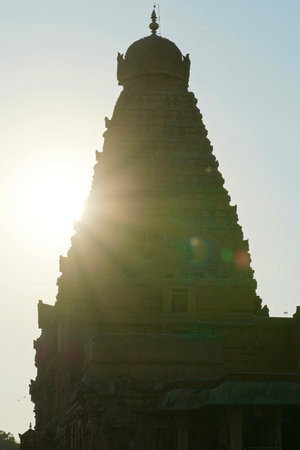 Brihadeeswarar temple in Thanjavur, Tamilnadu, India. Lord Shiva temple exterior tower against blue sky background. Ancient historical temple tower with Hindu God sculptures in Tamil nadu.の写真素材