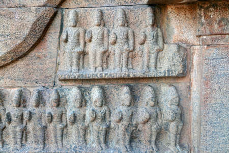 Bas relief ancient sculptures carved on the walls of historical Brihadeeswarar temple in Thanjavur,...