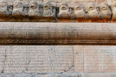 Inscriptions of Tamil language carved on the stone walls at Brihadeeswarar temple in Thanjavur,...