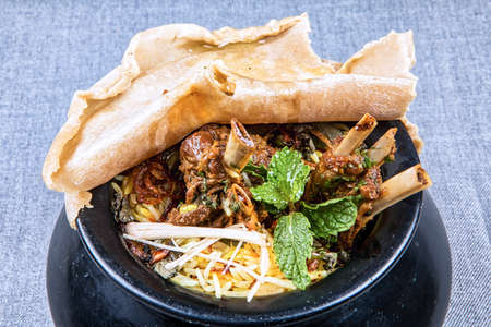 Mouthwatering Handi (a kind of pipkin) mutton Biriyni an indian cuisine in a bowl