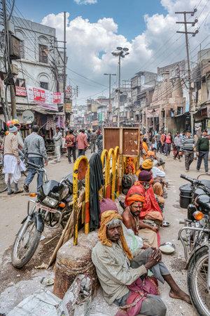 December 13th 2012, Varanasi, India: Street beggars sitting on a row outside of Viswanath Temple on the Dasaswamedh Road at Varanasiのeditorial素材