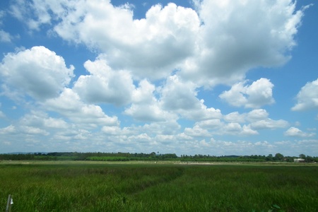 Mass of clouds over the prairie wide.の写真素材