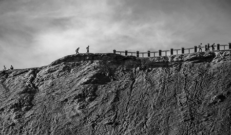 climbing Mt Bromo volcanic crater which is 2329 metres high, is an active volcano and part of the Tengger massif, in East Java, Indonesiaの写真素材