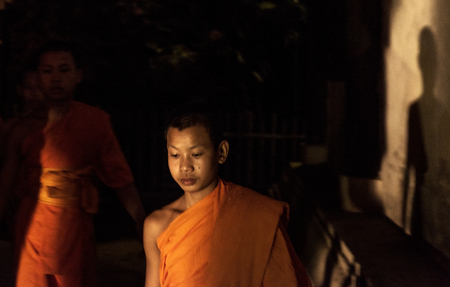 Monks walking after prayers at Yi Peng Festival celebrated on full moon of twelfth lunar month every year in Chiang Mai, Thailandのeditorial素材