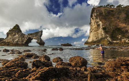 Indonesian Fishermen catching fish early morning in Atuh beach when the tide was low in Nusa Penida, Indonesiaのeditorial素材