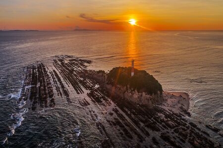 Aerial view of lighthouse covered with rocks at sunrise in Malaysiaの写真素材