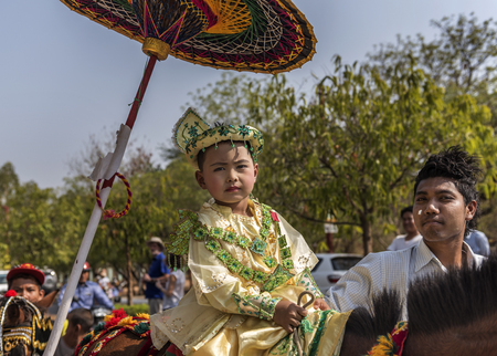 Bagan Myanmar 2016: Little boys dressed up like princess and going around Pagodas during Novication ceremony, Myanmarのeditorial素材