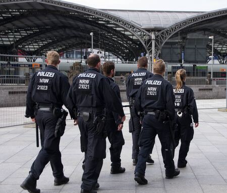 Cologne, North Rhine-Westphalia, Germany - June 12, 2016: Policemen patrolling near Cologne Cathedral and Hauptbahnhof.のeditorial素材