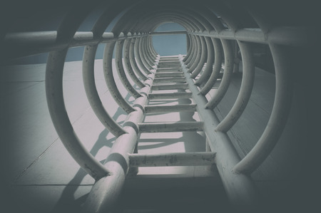 Escape: Steel Ladders with Safety Cages with filter effect.の写真素材