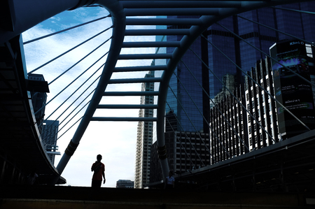 Bangkok, Thailand - Oct 10, 2016: Late in the morning, people walk on the BTS-BRT Sky Bridge at Sathon-Narmdhiwas Intersection. This area is a center of financial in Thailandのeditorial素材