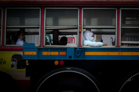Bangkok, Thailand - April 7 2020: Daily life on street in Bangkok. People wear a mask and follow to the Social Distancing campaign to protect coronavirus disease or COVID-19 pandemic.のeditorial素材
