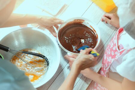 A Thai girl making browniesの写真素材