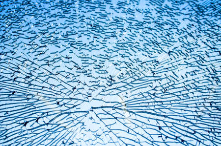 Tempered glass cracked closeup, backgroundの写真素材