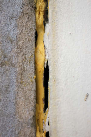 Spray PU foam used to fill gaps, cracks in the wall, but later on the wall increased separation.