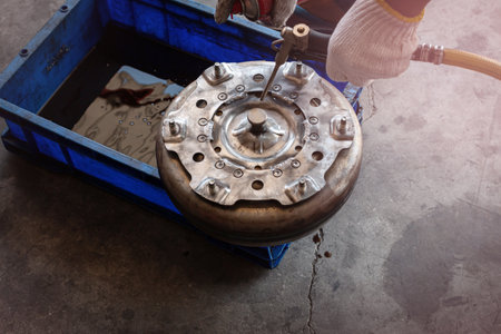 Worker is repairing the old oil filter in the oil refinery. Welding for strengthen anchor pin of plate and torque  Converter for Automatic Transmissionの写真素材