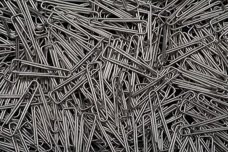 Paper clips on black background