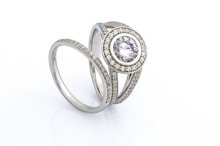His and hers wedding rings set on white backgroundの写真素材