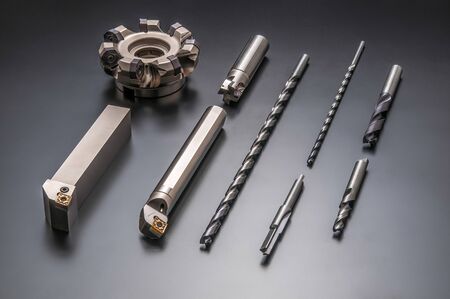 Auto parts and drilling bits photo on black backgroundの写真素材