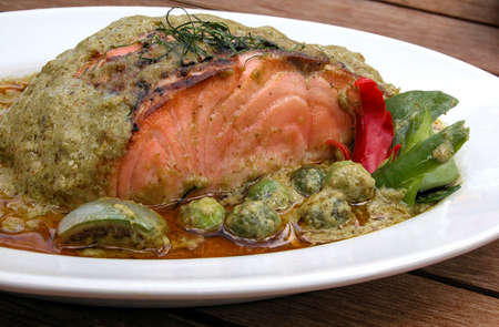 Salmon fish with green curry sauceの写真素材