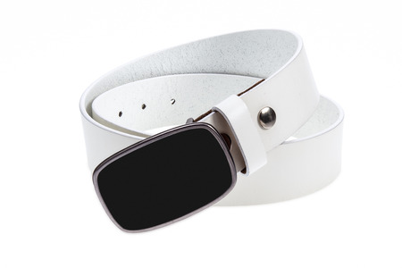 Leather white belt with metal, black buckle on white backgroundの写真素材