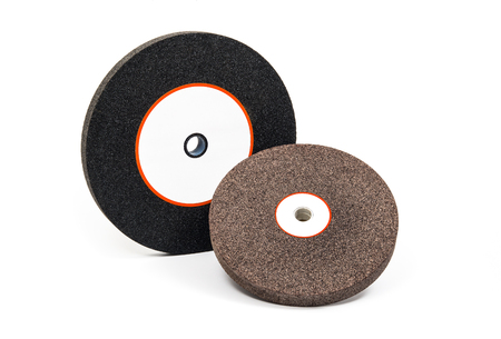 Industrial grinding and polishing wheels on white backgroundの写真素材