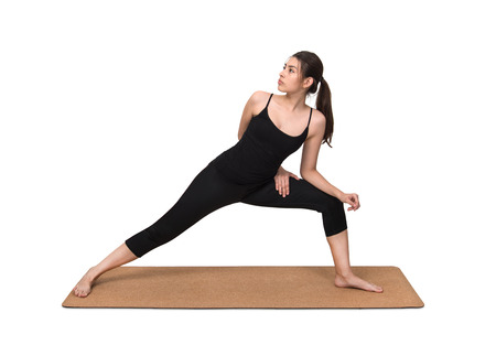 Young woman exercise yoga pose on cork yoga mat on white backgroundの写真素材
