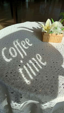 Coffee time text on the white table in the cafe.