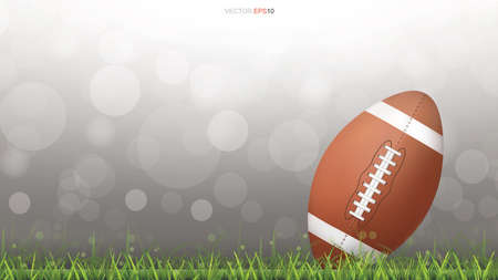 American football ball or rugby football ball on green grass court with light blurred bokeh background. Vector illustration.のイラスト素材