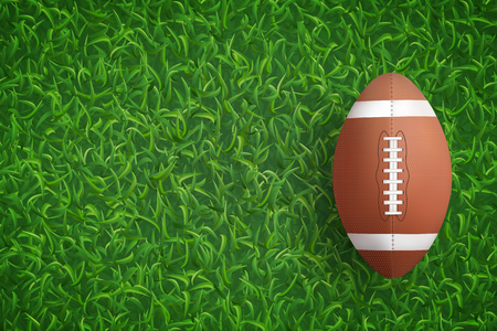 American football ball on green grass texture background. Vector illustration.のイラスト素材