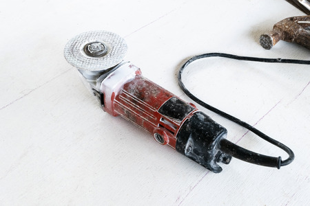 Electric grinding machine on white background.