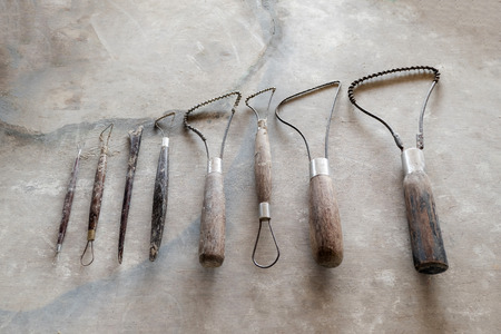 Sculpture tools. Art and craft tools on vintage wood background. Close-up image.の写真素材