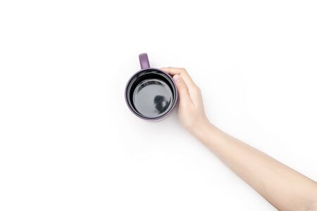 Coffee cup in hand. Isolated on white backgroundの写真素材