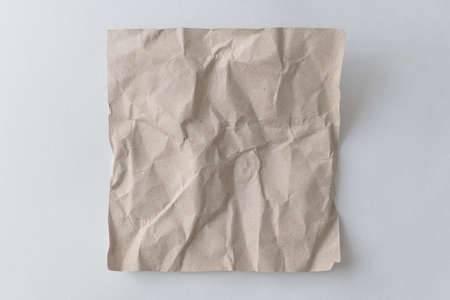 Brown wrinkle recycle paper background. Crumpled brown paper on white background, can use text banners products or business cards.の写真素材