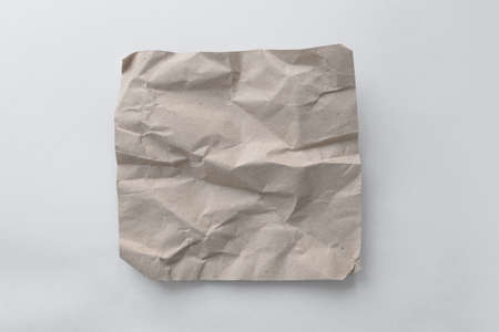 Brown wrinkle recycle paper background. Crumpled brown paper on white background, can use text banners products or business cards.の写真素材