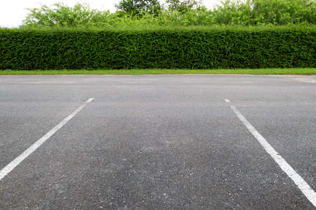 Empty parking lot in outdoor parking area.