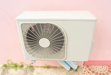 Condensing unit of air conditioning systems. Condensing unit installed on the wall.