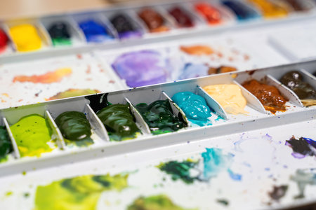 Colorful of watercolor tray background with watercolor set. Selective focus image.の写真素材