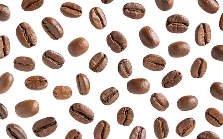 Roasted coffee beans. Scattered coffee beans on a white background with clipping paths. Close up.