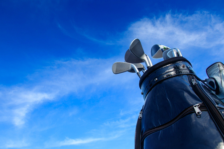 Golf club in bag with blue sky background.の写真素材