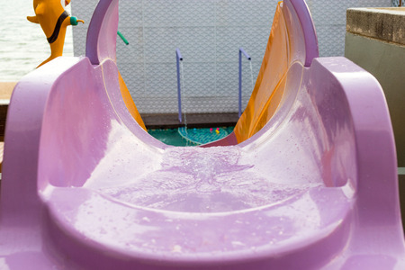 swimming pool with slide. summer holiday concept.