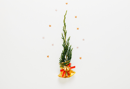 Top view of pine branches, bell, star on white background. Christmas concept.の写真素材